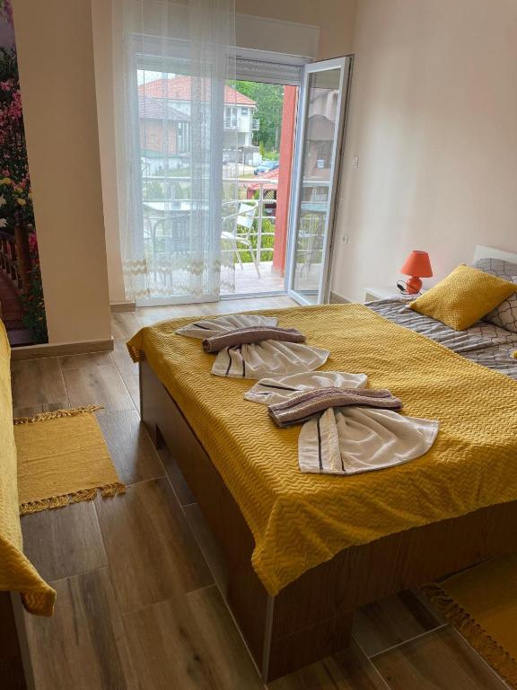 Postel nebo postele na pokoji v ubytování Apartmani Andrijana