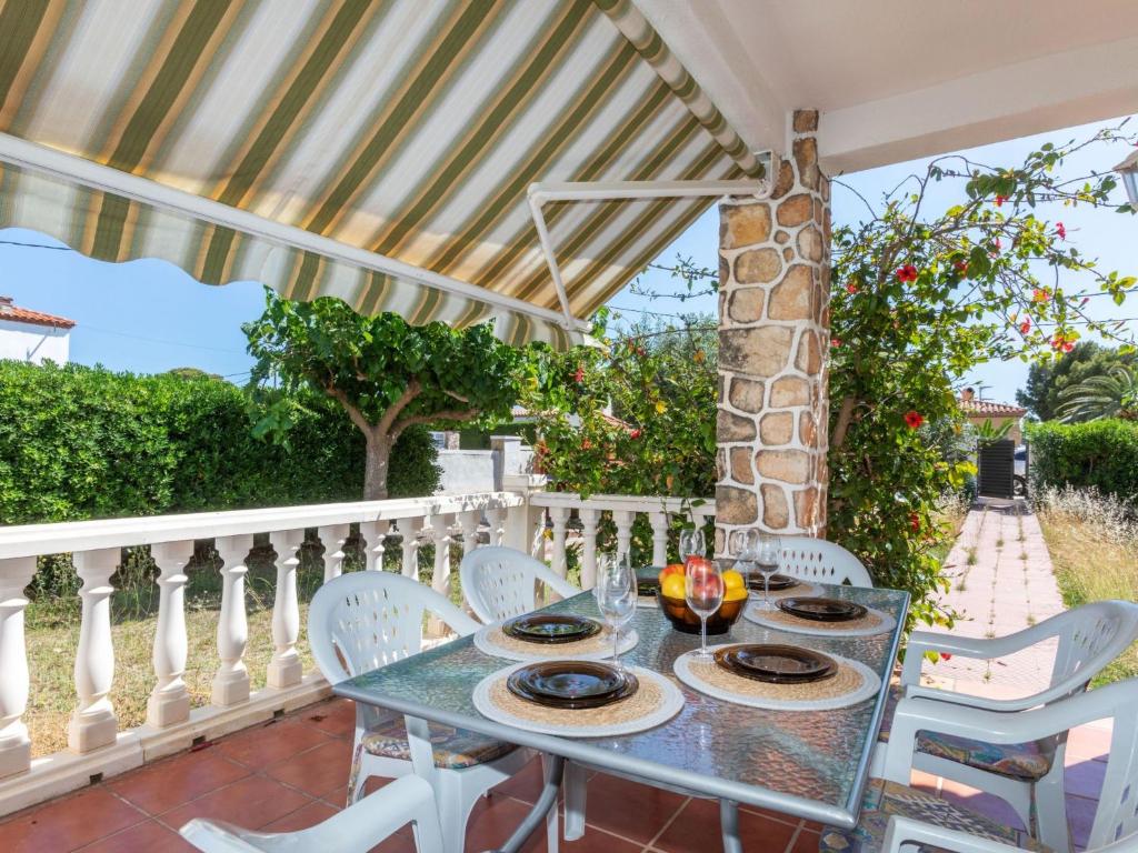 a table and chairs on the balcony of a house at Holiday Home Omega by Interhome in L'Ametlla de Mar