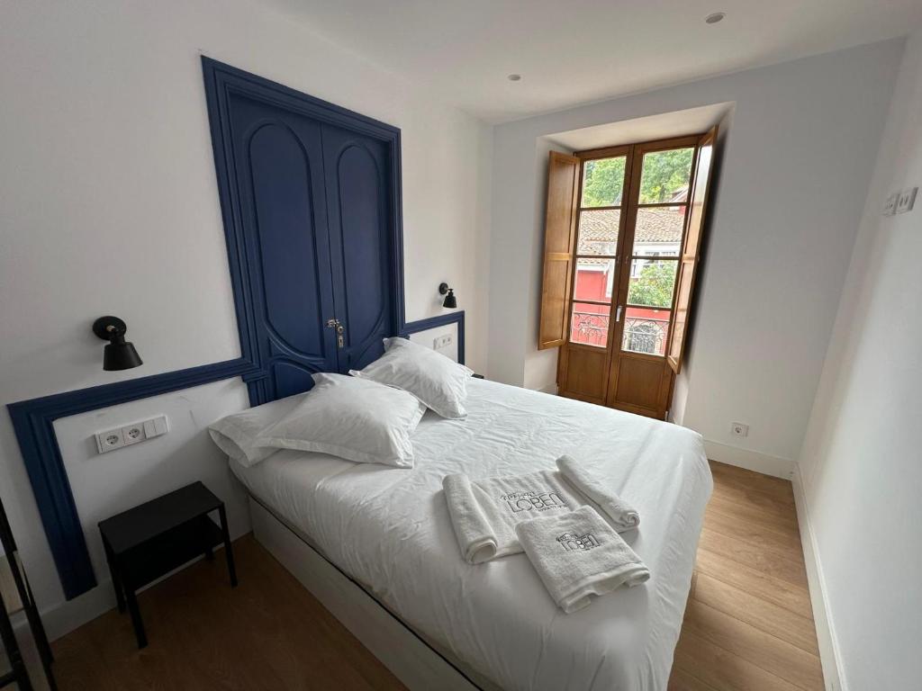 Postel nebo postele na pokoji v ubytování Loben Casona del Deva