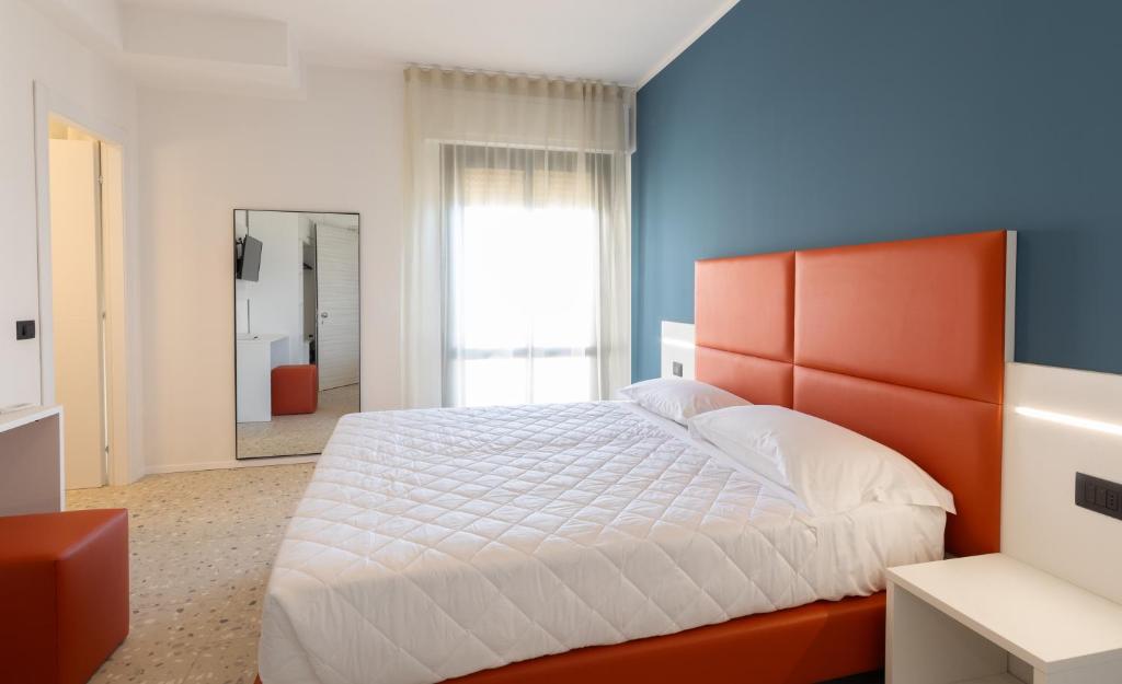 Postel nebo postele na pokoji v ubytování Hotel Delaville Frontemare