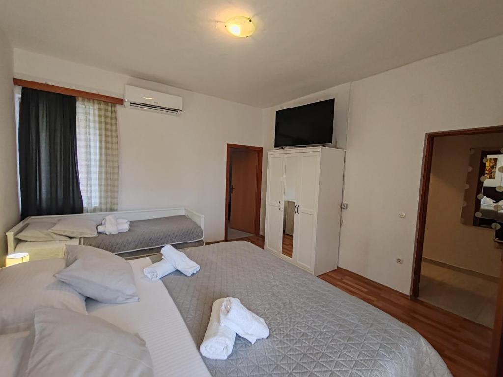 Postel nebo postele na pokoji v ubytování Apartments and pansion M&R