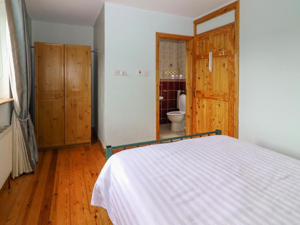 Postel nebo postele na pokoji v ubytování Levally House