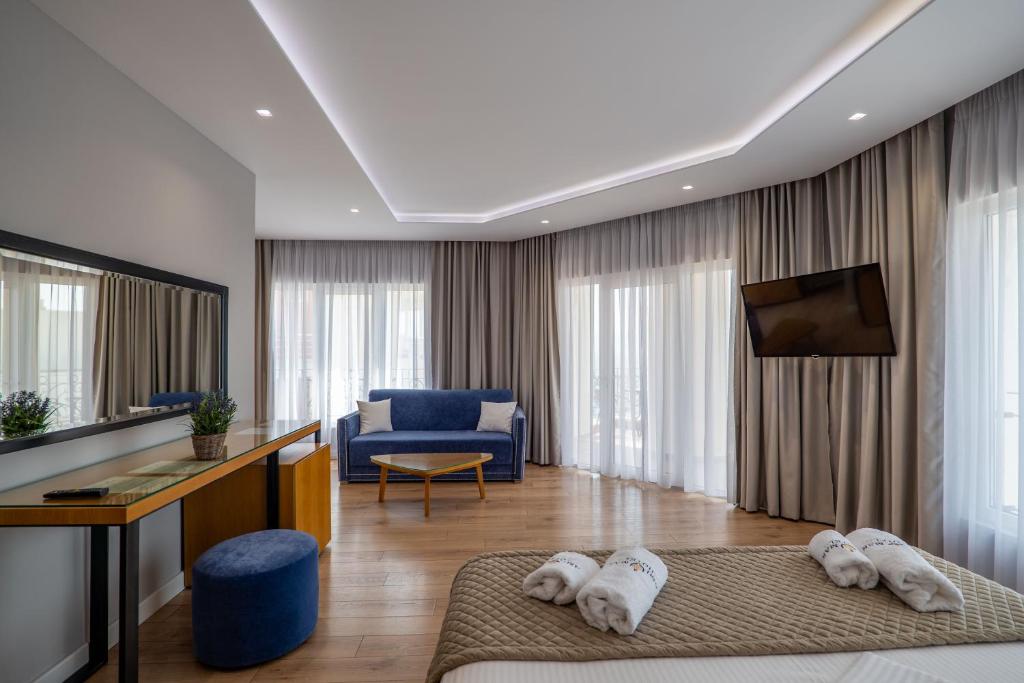 Postel nebo postele na pokoji v ubytování AMI MAR Hotel
