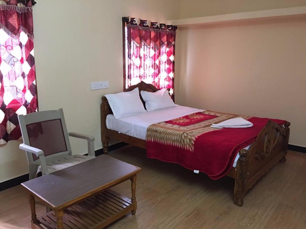 Postel nebo postele na pokoji v ubytování Bamboo Holiday Resort & Homestay Yercaud