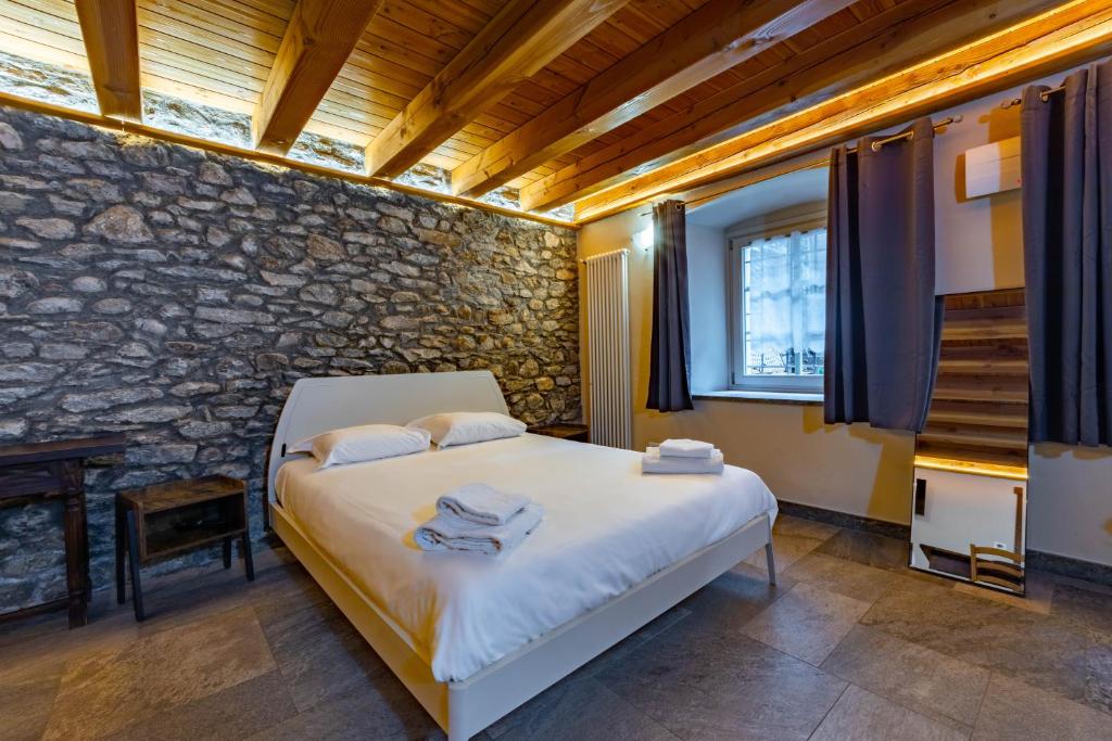 Posteľ alebo postele v izbe v ubytovaní Inn Aosta Apartments