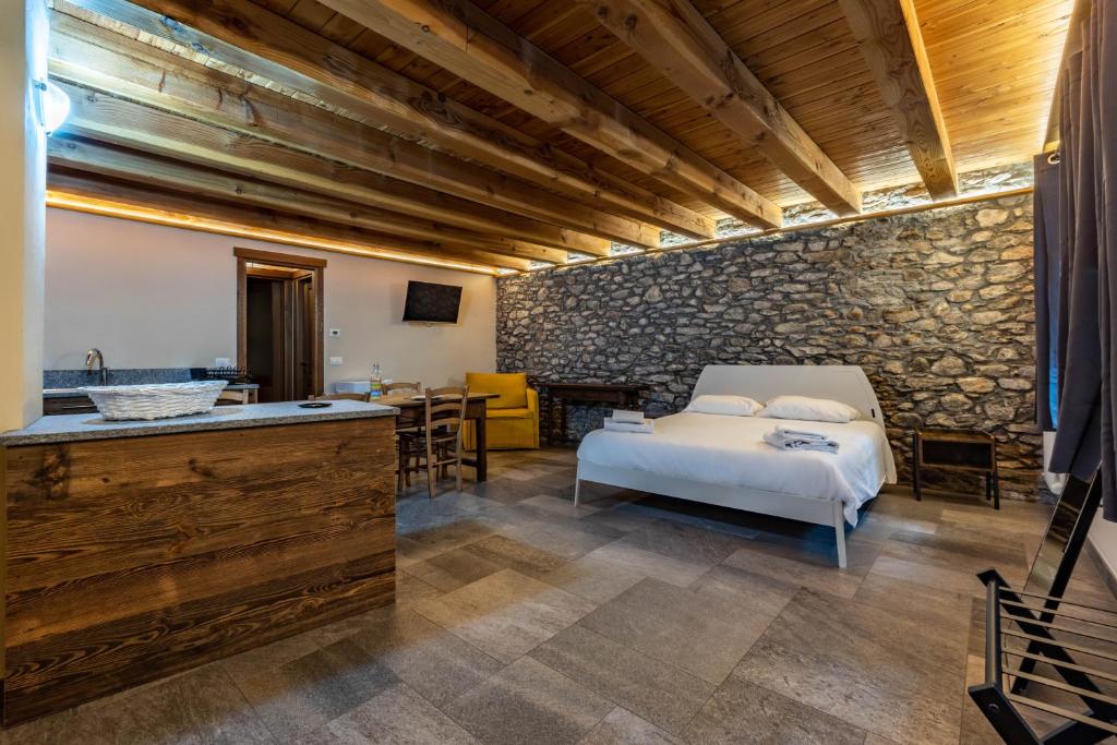 Posteľ alebo postele v izbe v ubytovaní Inn Aosta Apartments