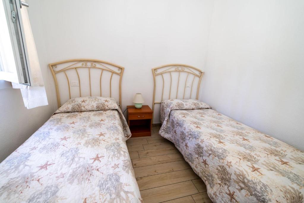 Postel nebo postele na pokoji v ubytování Onda
