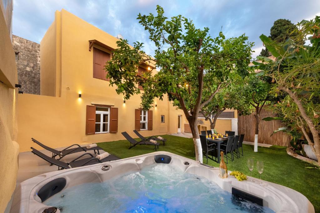 a pool in the backyard of a house at 3-4 Bedrooms Villa in old Town in Rhodes Town