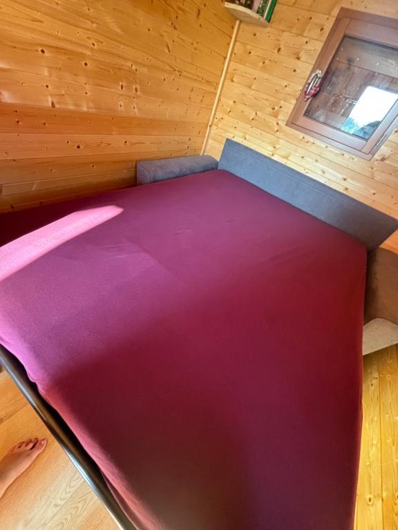 Postel nebo postele na pokoji v ubytování La Rouloulotte