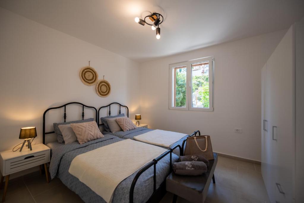 Postel nebo postele na pokoji v ubytování Villa Bokeljka