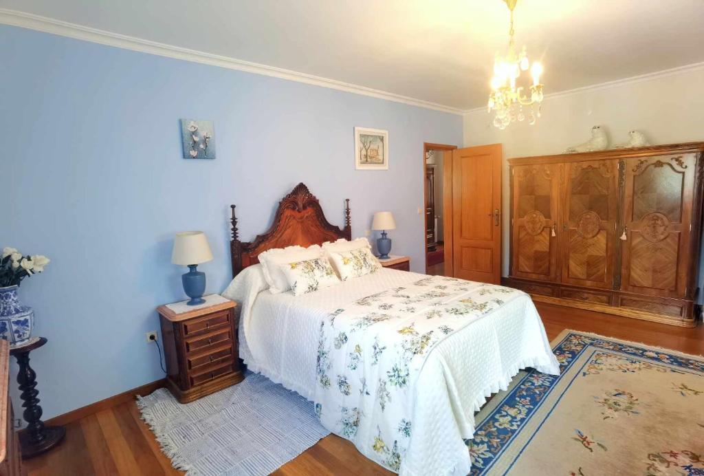 Postel nebo postele na pokoji v ubytování Casa dos Encantos