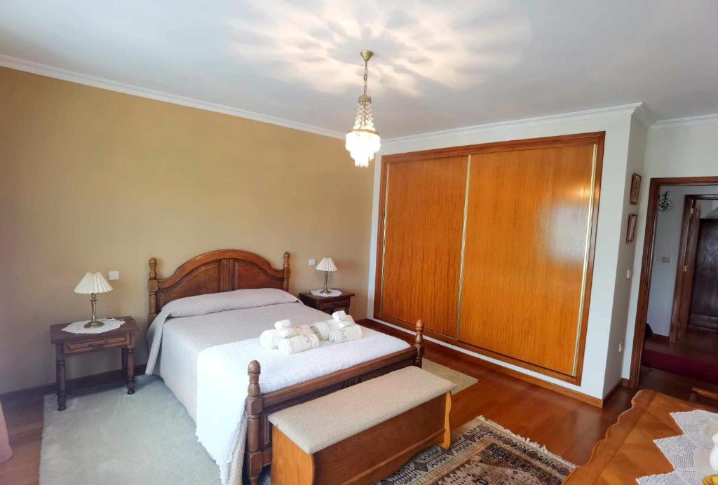 Postel nebo postele na pokoji v ubytování Casa dos Encantos