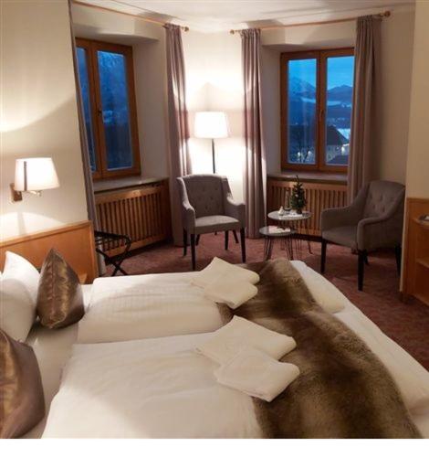 Postel nebo postele na pokoji v ubytování Hotel Strasser