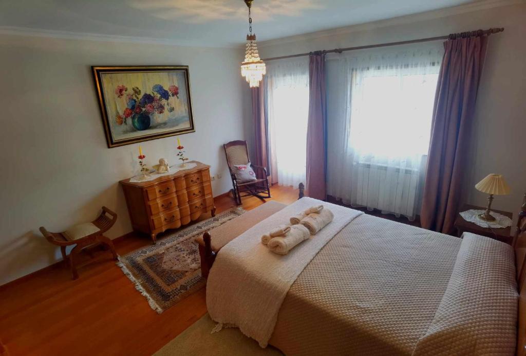 Postel nebo postele na pokoji v ubytování Casa dos Encantos