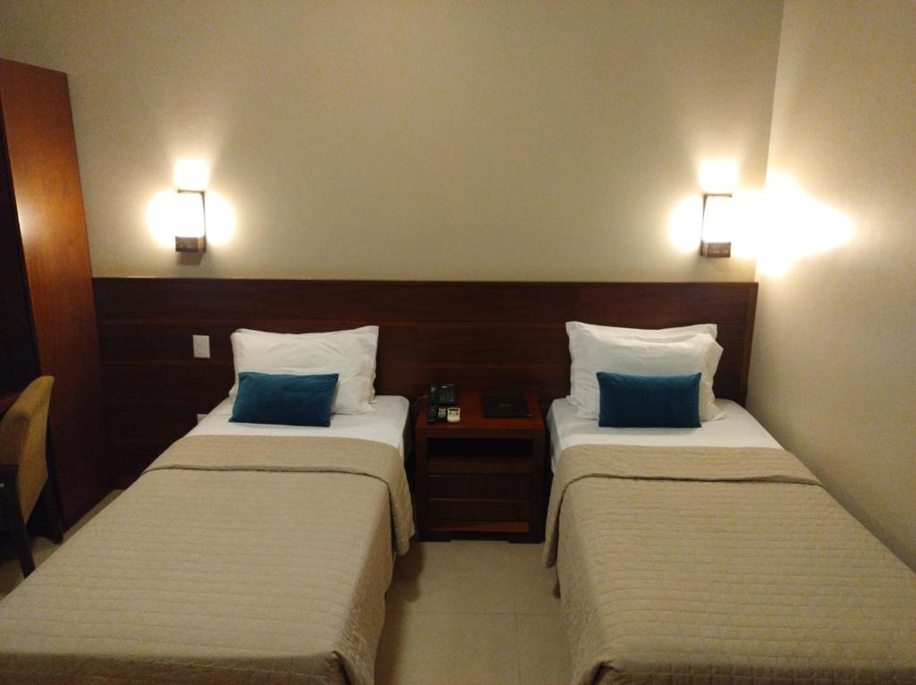 Postel nebo postele na pokoji v ubytování Hotel Pousada Santa Rita