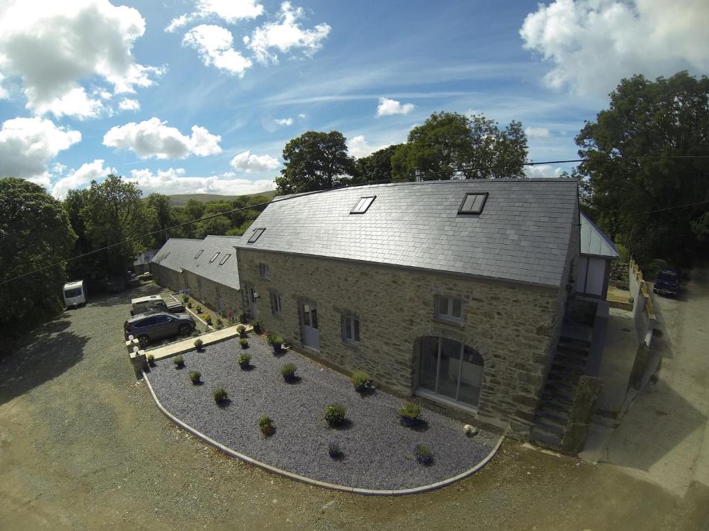 an aerial view of a building with a car parked next to it at Rhostwarch in Eglwyswrw