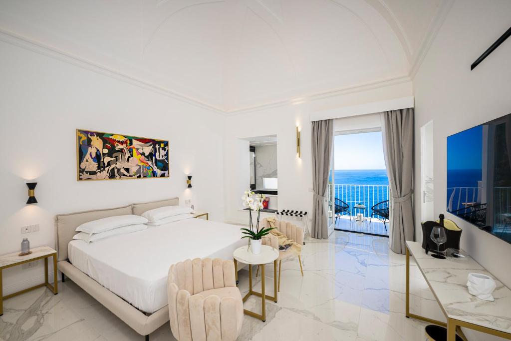 Postel nebo postele na pokoji v ubytování Gianlica Suites Positano