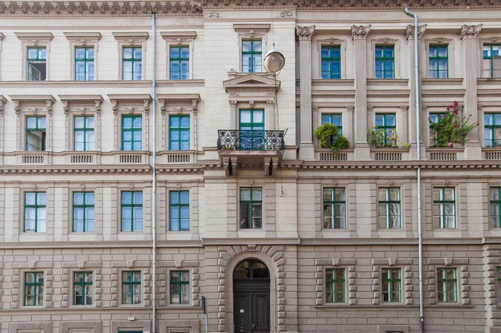 a large building with windows and a balcony at Style&Art Apartment in Budapest