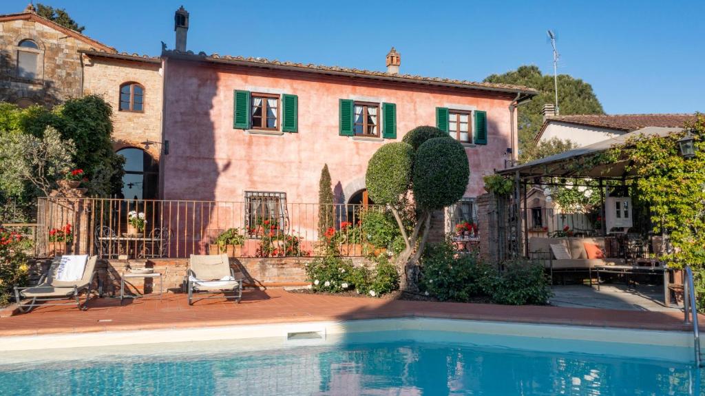 a house with a swimming pool in front of a house at Villa with swimming pool in San Gimignano in San Gimignano
