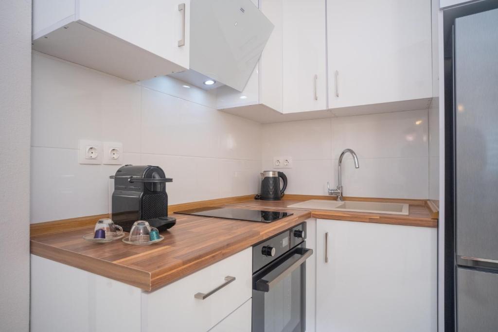 Kuchyň nebo kuchyňský kout v ubytování Cozy Home