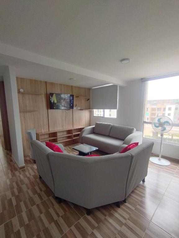 a living room with a couch and a table at Apartamento Ibagué in Ibagué