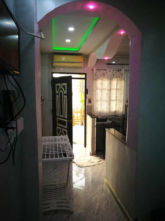 a hallway with a green light in a room at STUDIO Jijel in Jijel