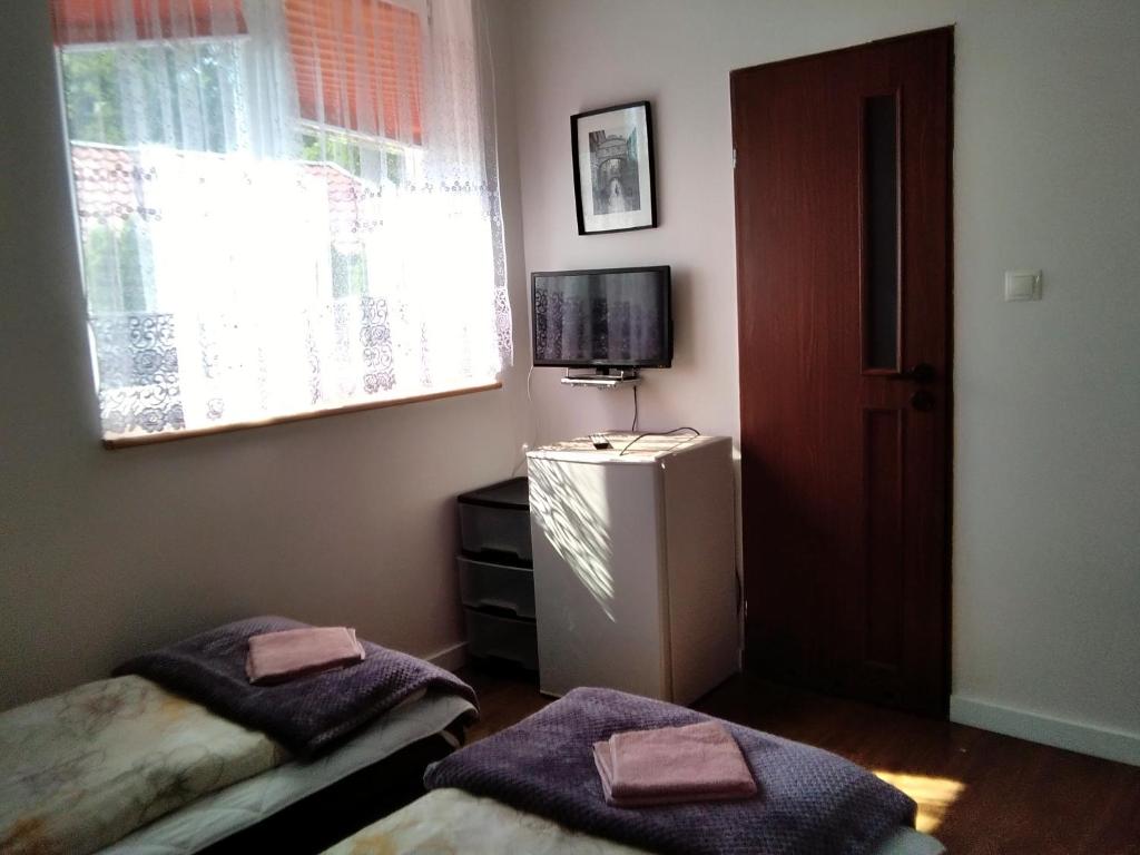 Postel nebo postele na pokoji v ubytování Pokoje Morska