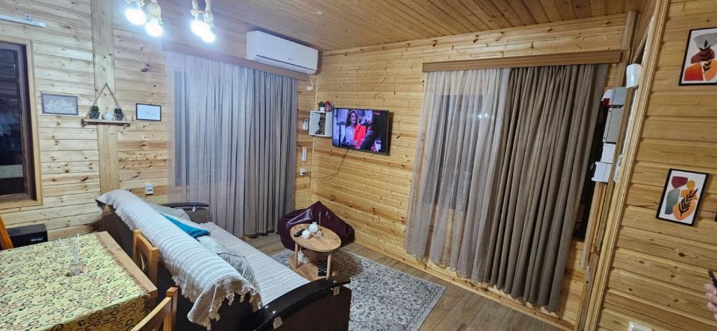 TV a/nebo společenská místnost v ubytování Cottage lima