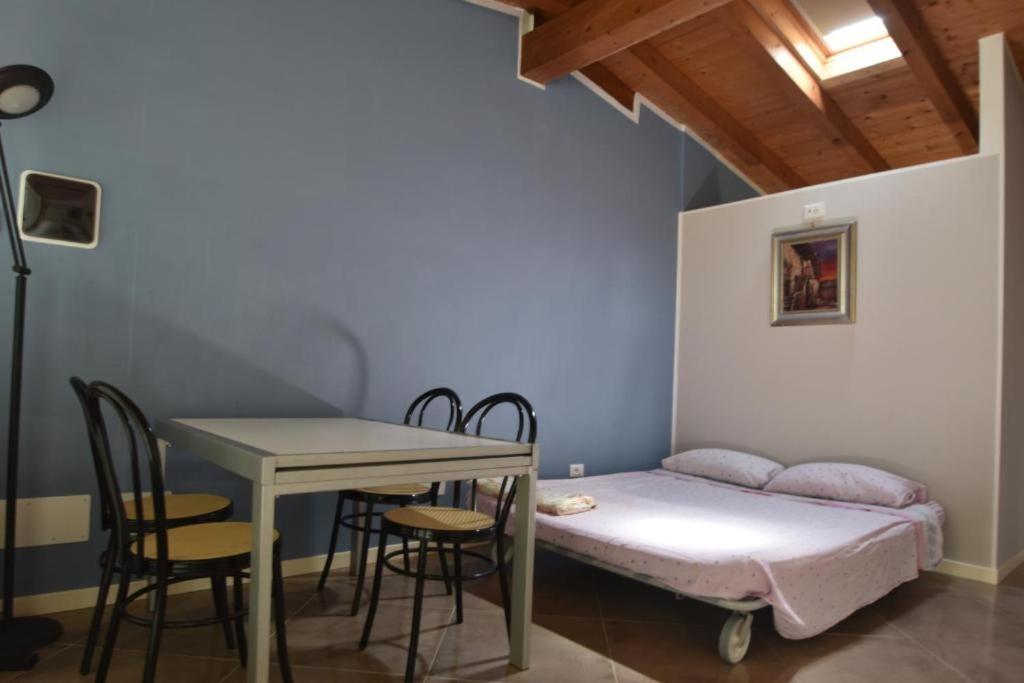 Postel nebo postele na pokoji v ubytování Akihouse by Mauro