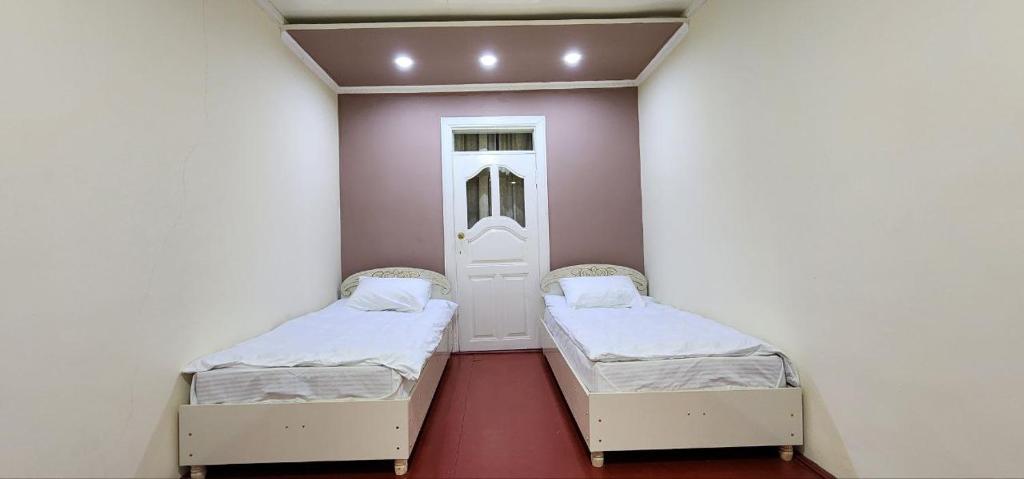 Postel nebo postele na pokoji v ubytování Sim-Sim Hostel