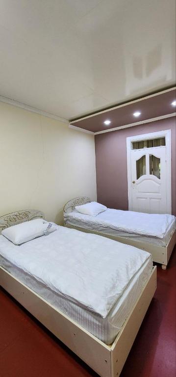 Postel nebo postele na pokoji v ubytování Sim-Sim Hostel