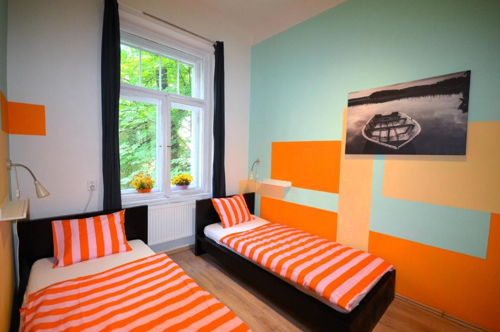Postel nebo postele na pokoji v ubytování Travel&Joy backpackers