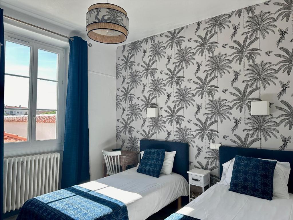 Postel nebo postele na pokoji v ubytování Hôtel Parc Mazon-Biarritz