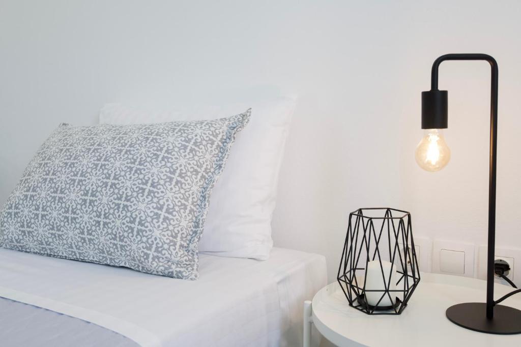 Postel nebo postele na pokoji v ubytování Alexander Suites