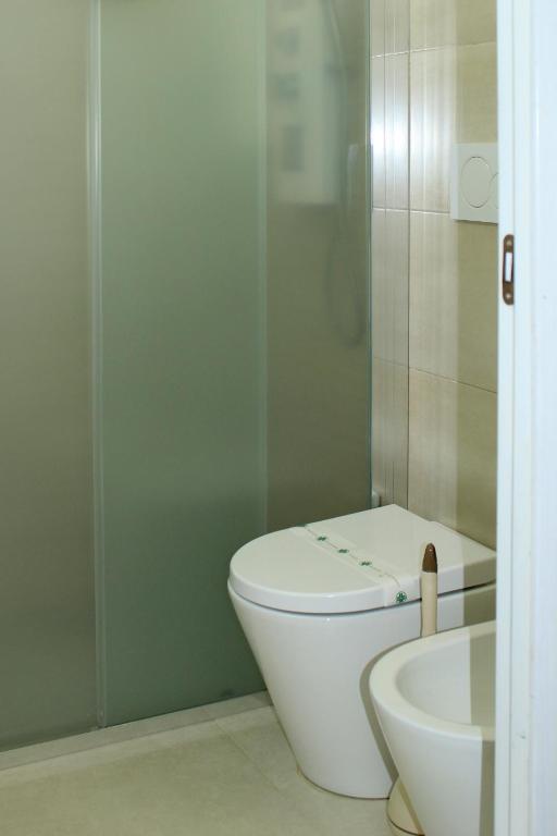a bathroom with a toilet and a sink at Tenuta Paifer in Otranto