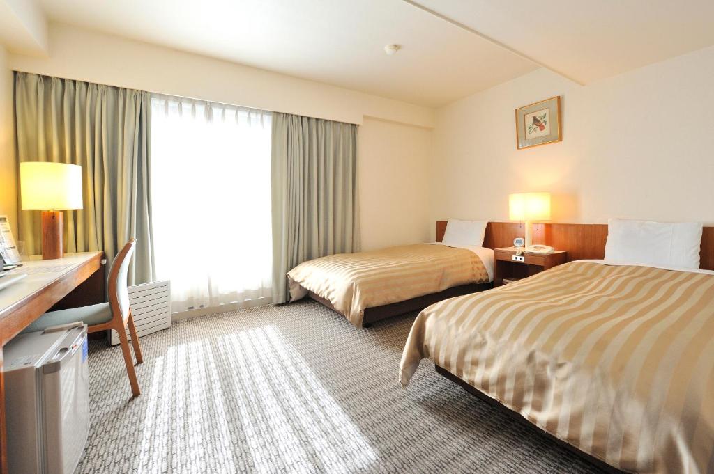 Postel nebo postele na pokoji v ubytování Hotel Gimmond Kyoto