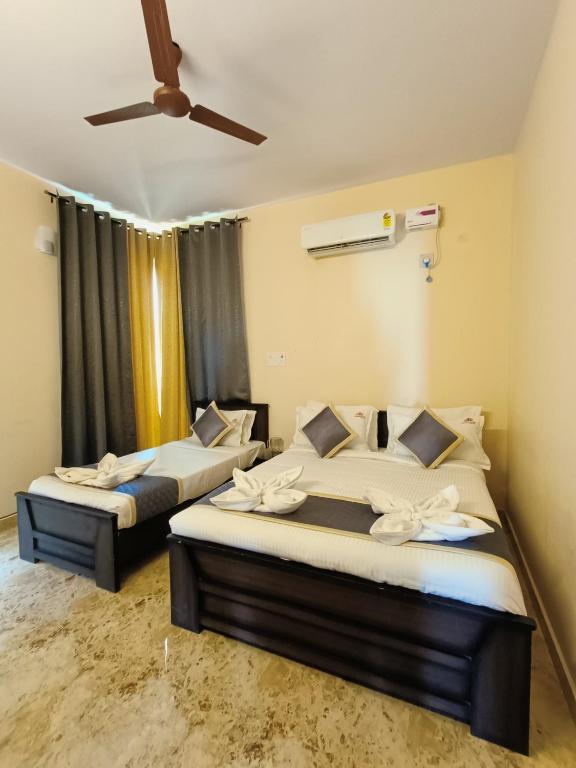 Postel nebo postele na pokoji v ubytování Neighbour Inn - Apart Hotel