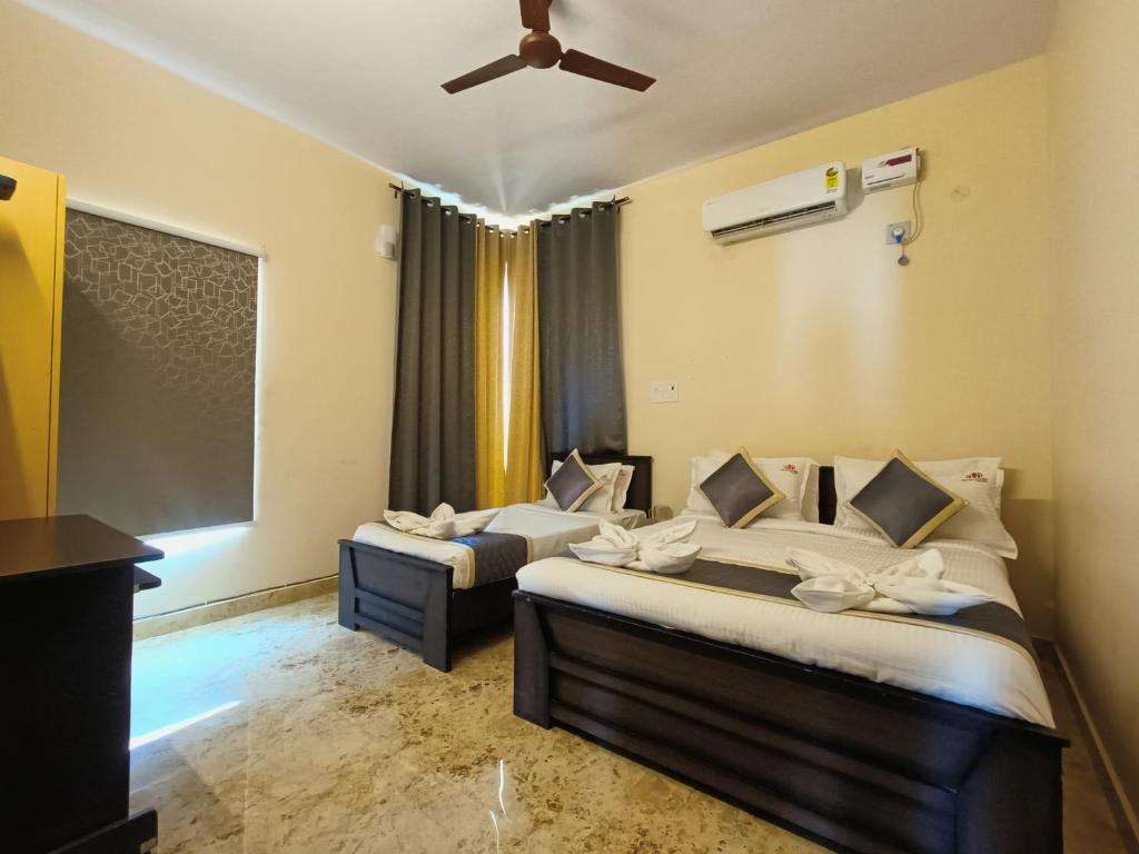 Postel nebo postele na pokoji v ubytování Neighbour Inn - Apart Hotel