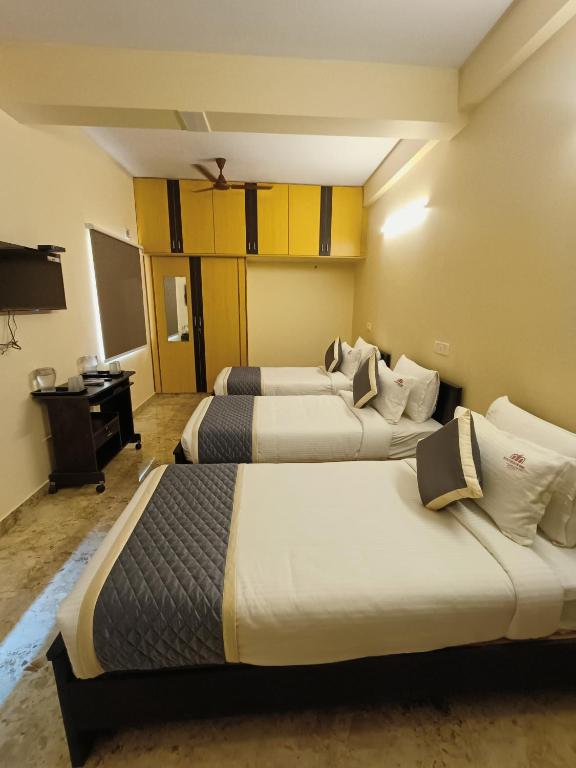 Postel nebo postele na pokoji v ubytování Neighbour Inn - Apart Hotel
