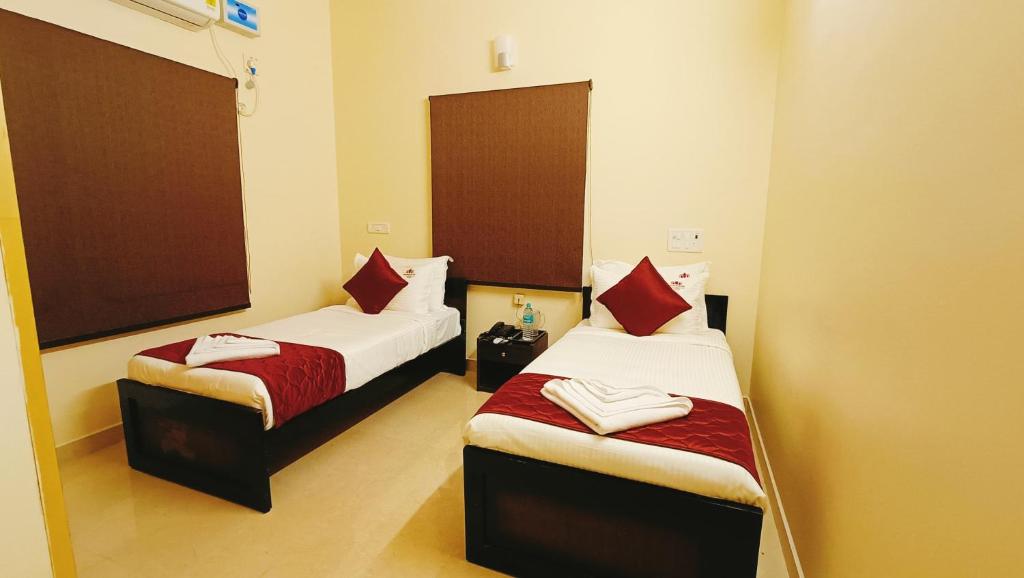 Postel nebo postele na pokoji v ubytování Neighbour Inn - Apart Hotel