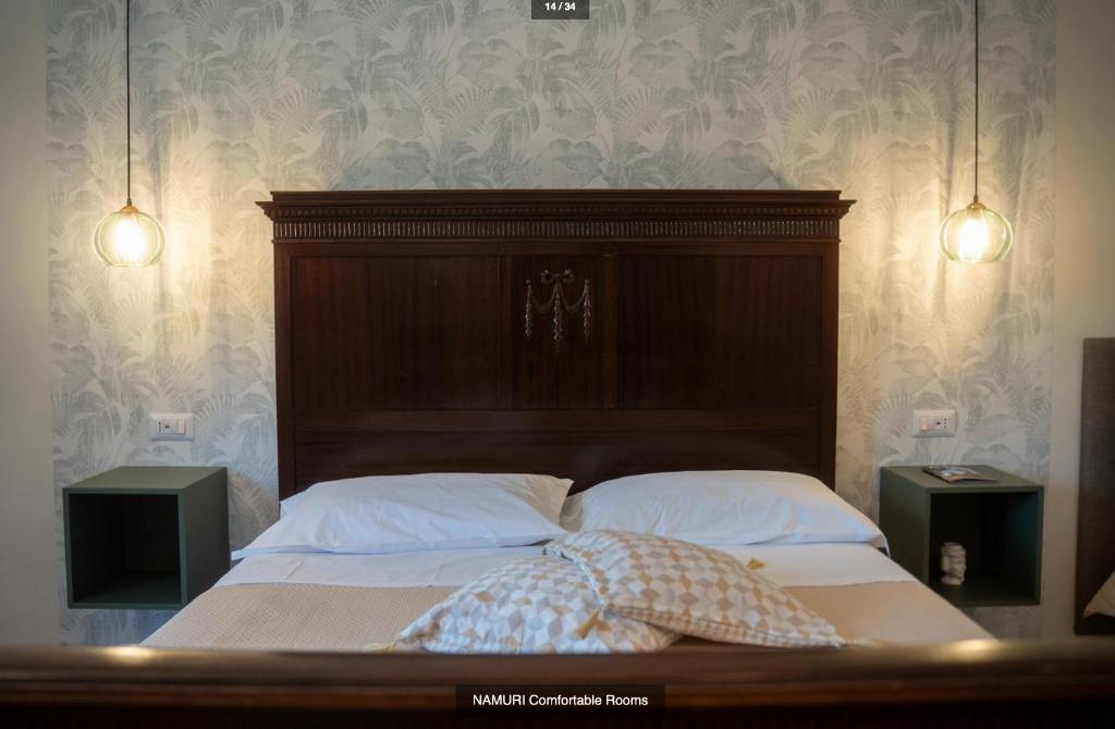 Postel nebo postele na pokoji v ubytování Namuri Comfortable Rooms