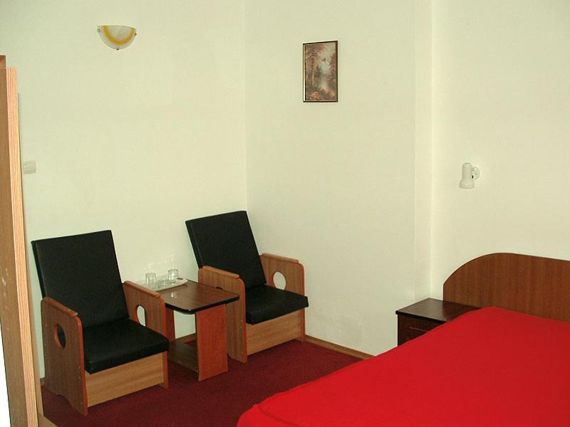 Postel nebo postele na pokoji v ubytování Hotel Uranus