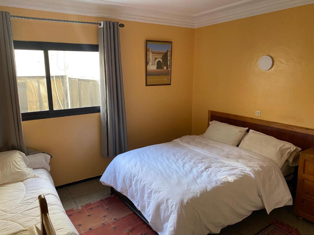 Postel nebo postele na pokoji v ubytování Hôtel Petite Suède