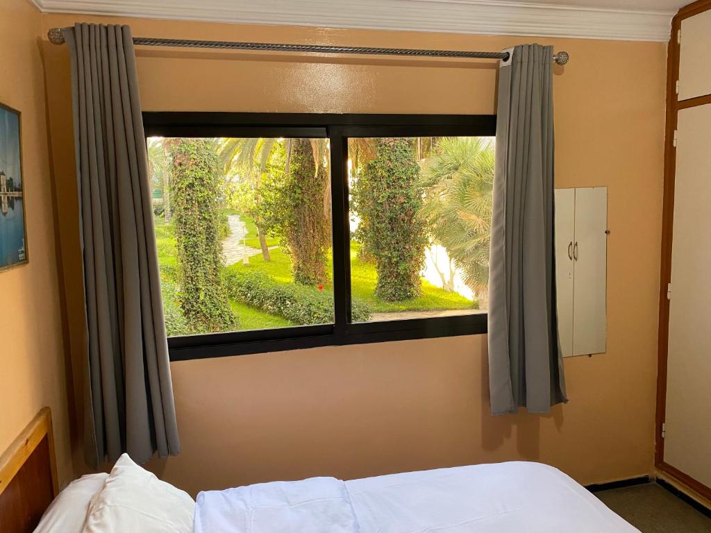 Postel nebo postele na pokoji v ubytování Hôtel Petite Suède