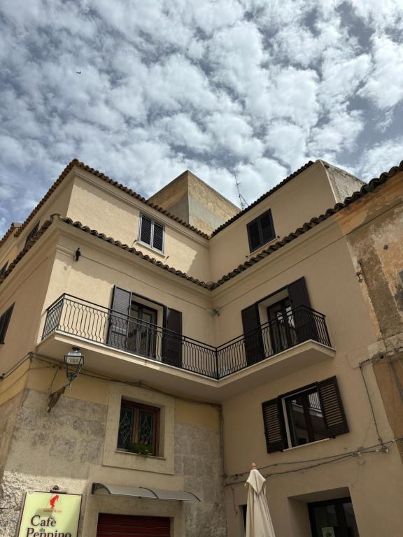 a building with two balconies on top of it at La Corte degli Scolopi in Palma di Montechiaro