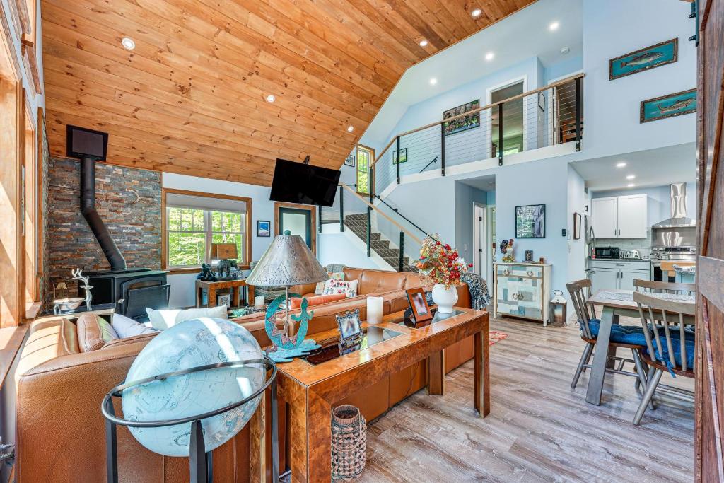 a living room with a wooden ceiling at Near Hiking Trails and Ski Resorts Killington Home! in Killington