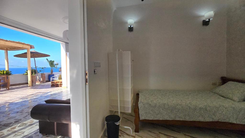 Postel nebo postele na pokoji v ubytování DAR EL CADI -Quaa Assrasse-