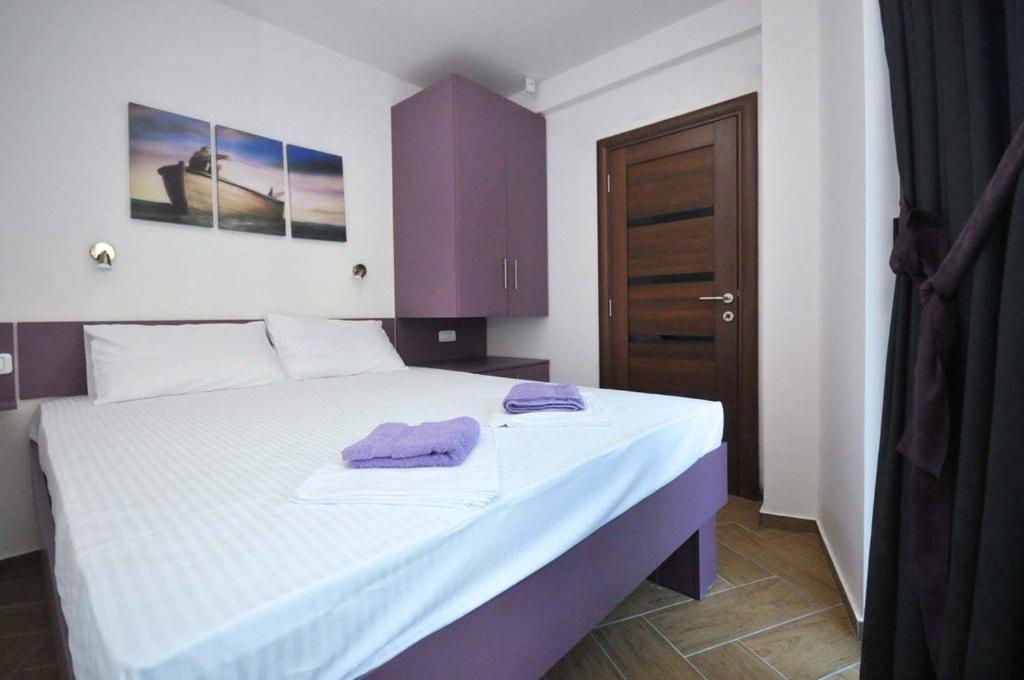 Postel nebo postele na pokoji v ubytování Apartments M Čanj
