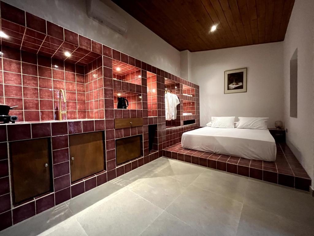Postel nebo postele na pokoji v ubytování Stin Avli tou Pavlou Guest House