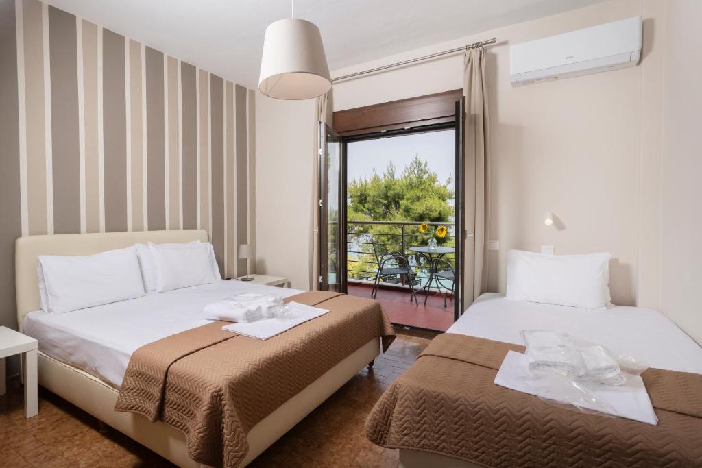 Postel nebo postele na pokoji v ubytování Sea View Apollo Apartments & Studios in Afytos